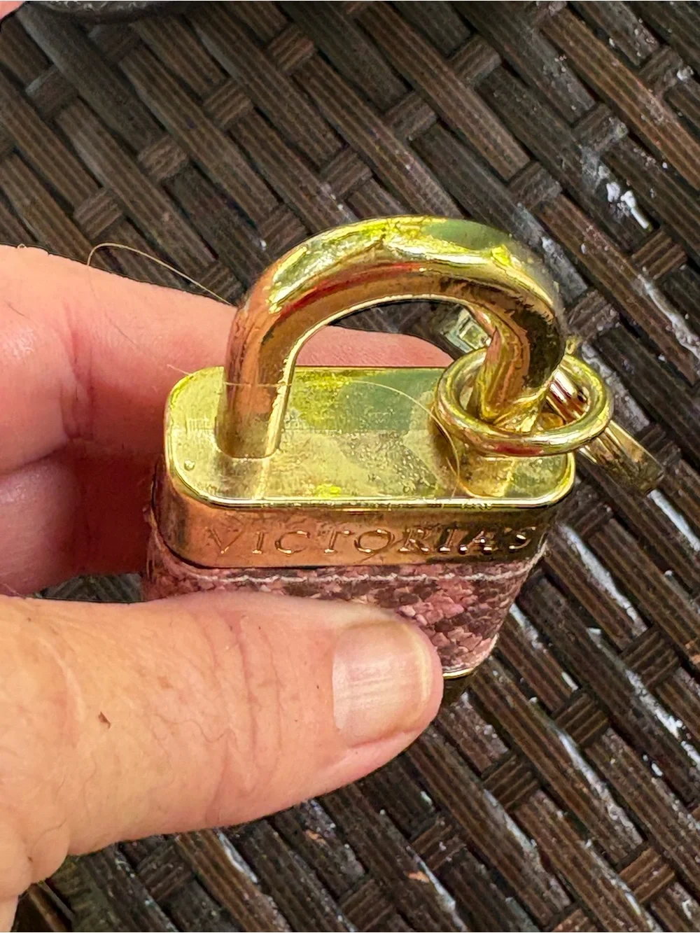 Victoria's Secret padlock keychain features a rose gold finish and a pink snakes